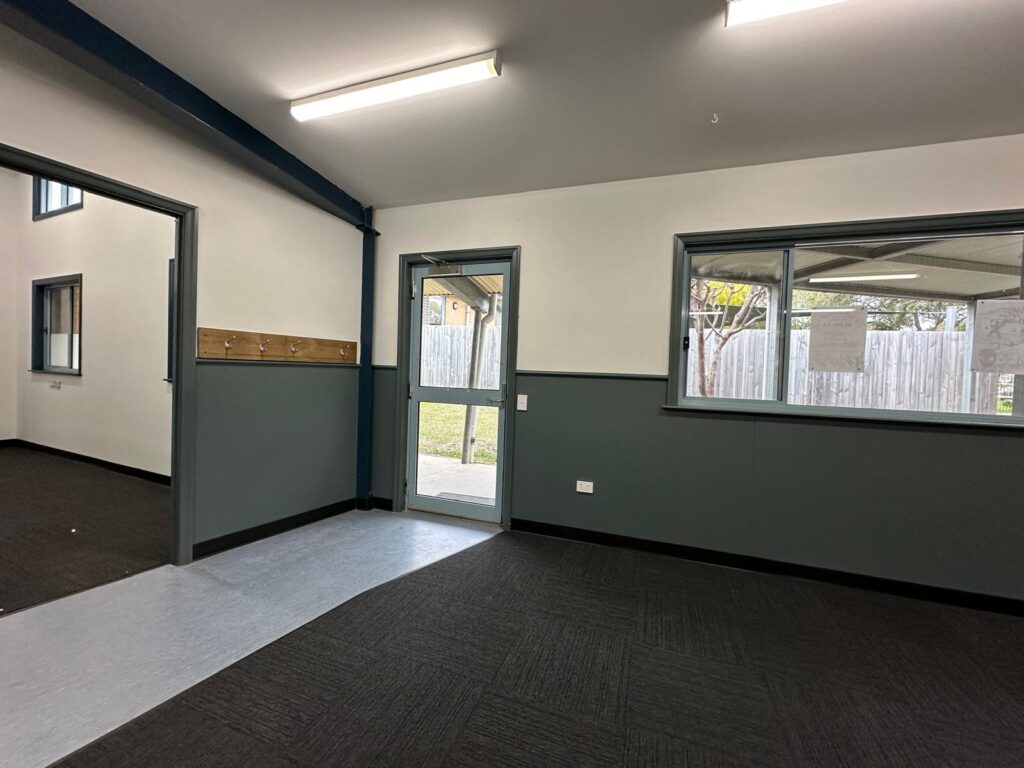 Restored open teaching area with new carpet, cleaned walls and stabilised environment