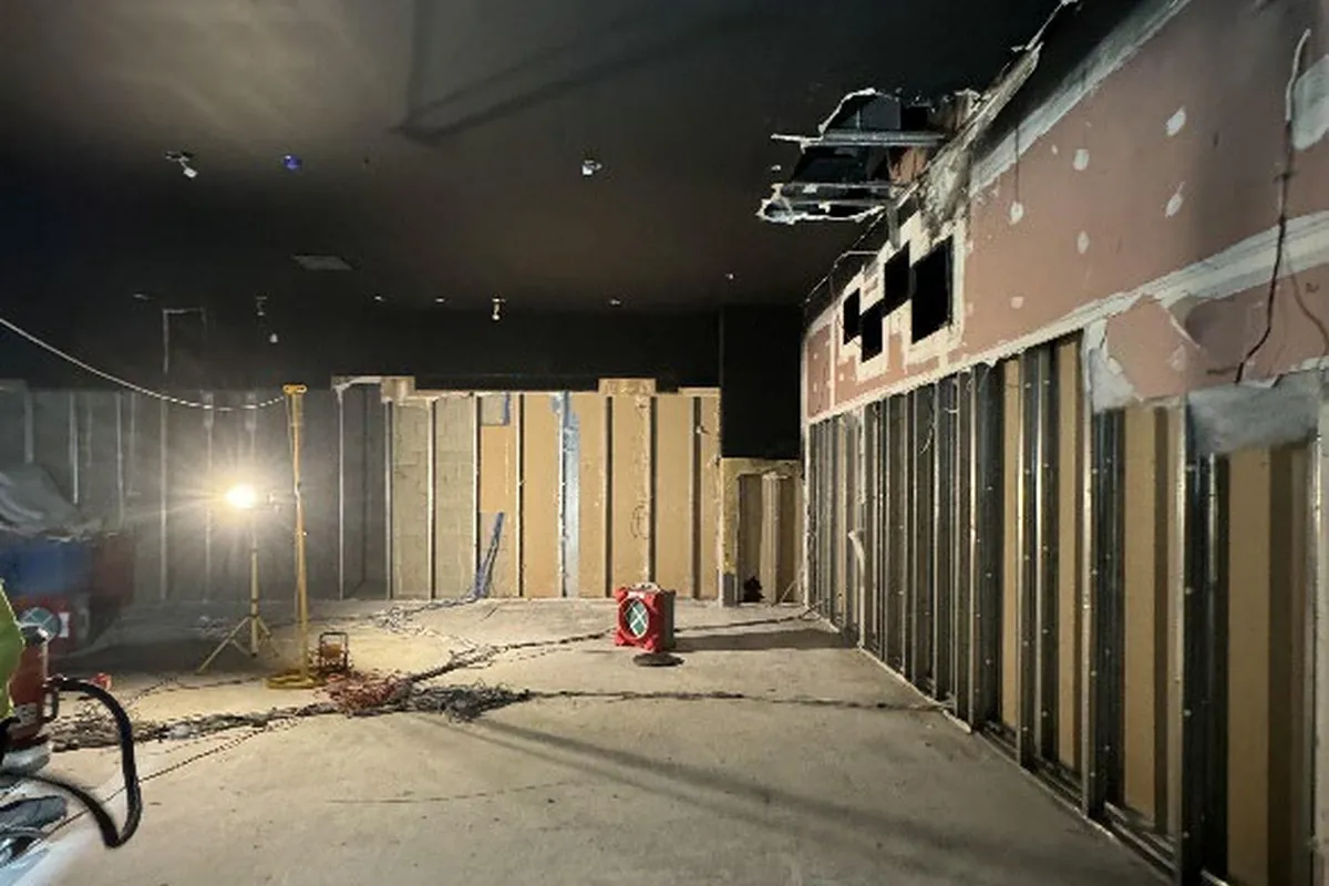 Protective floor covering installed through the access route