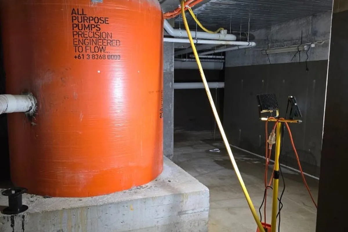 Industrial tank and tripod lighting inside the plant area