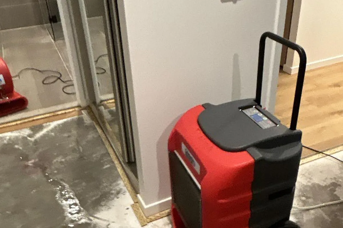 Dehumidifier operating within an affected apartment