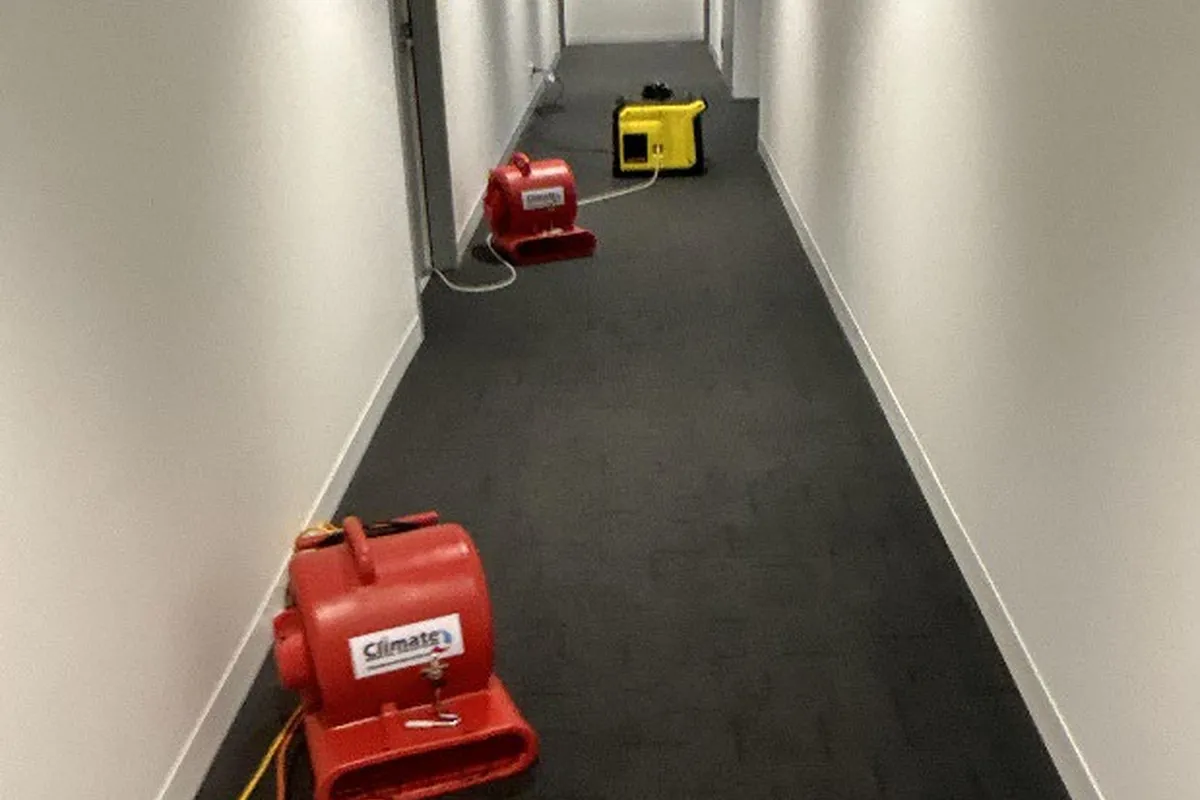 Air movers positioned along an affected passageway