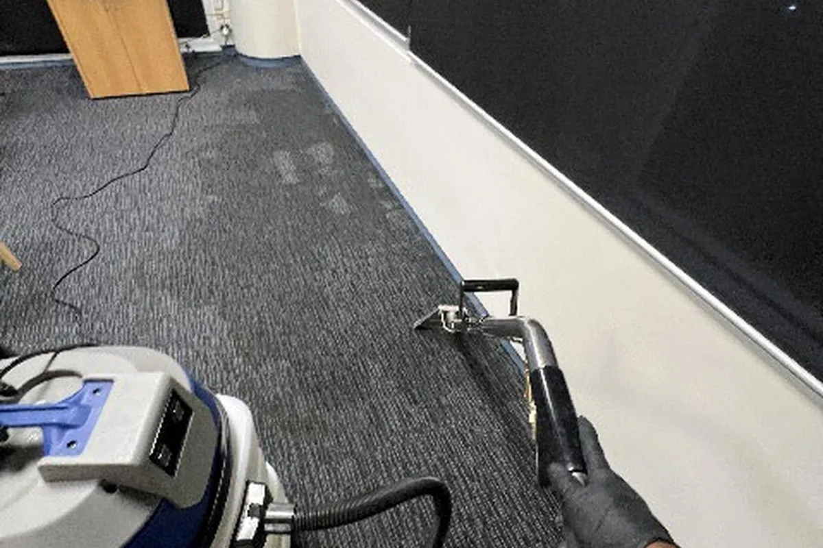 Extraction being performed on affected carpet tiles