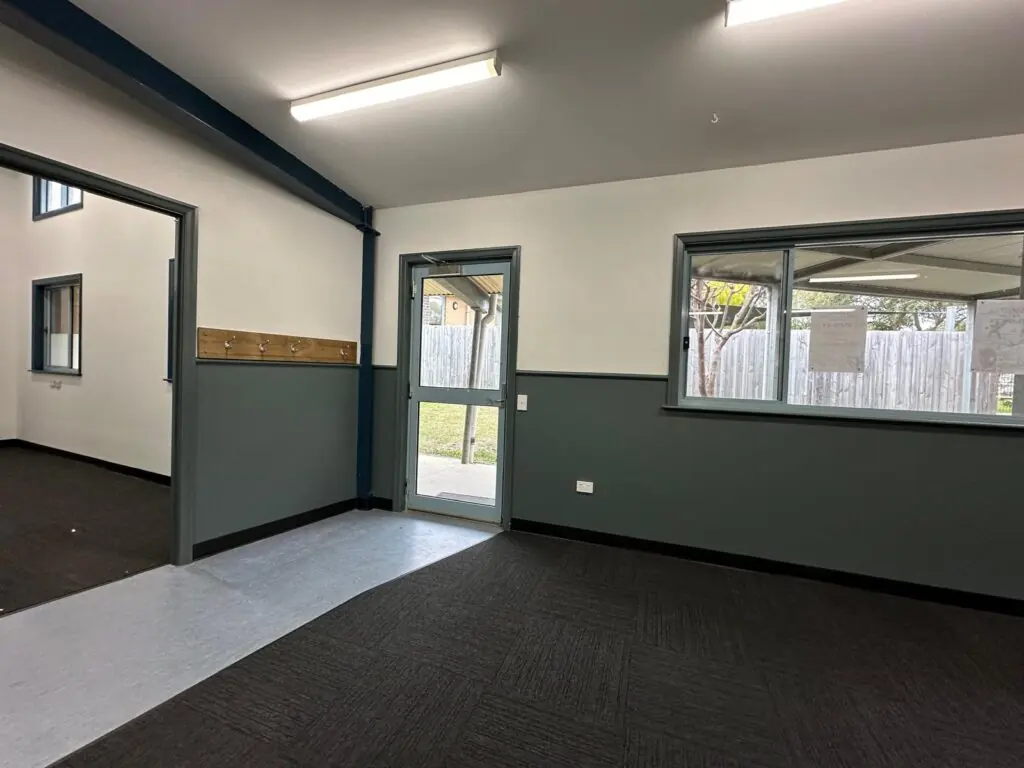 Restored open teaching area with new carpet, cleaned walls and stabilised environment